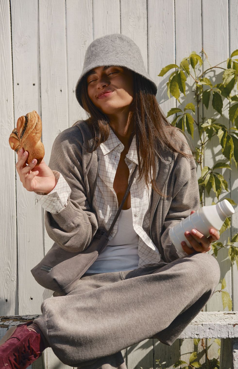 Model with bread and a bottle of milk