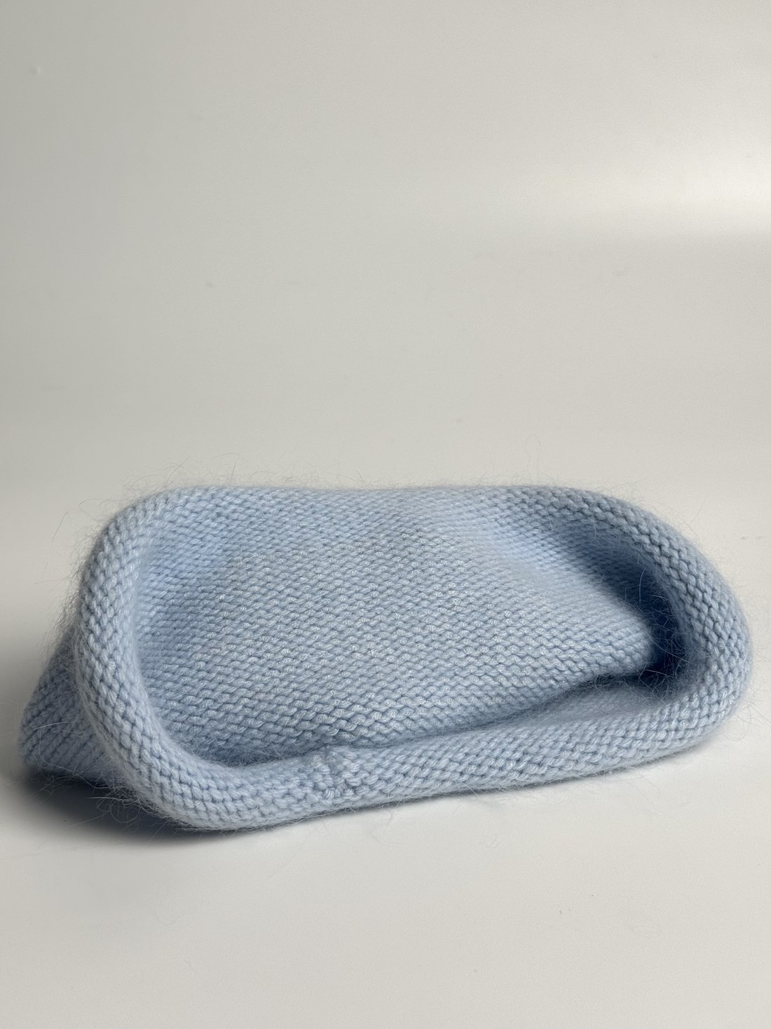 Hat photographed on a phone, folded