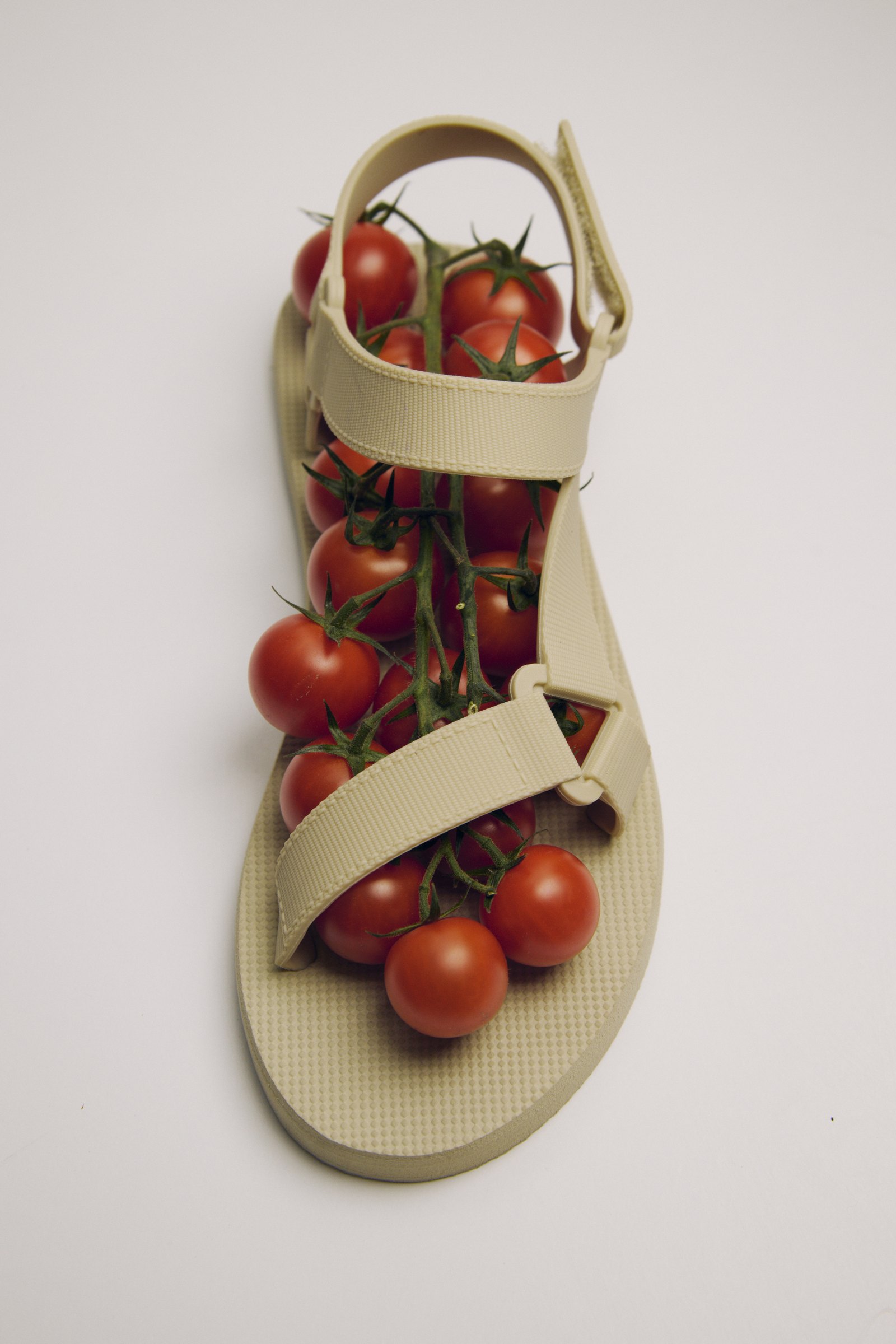 Sandal filled with cherry tomatoes