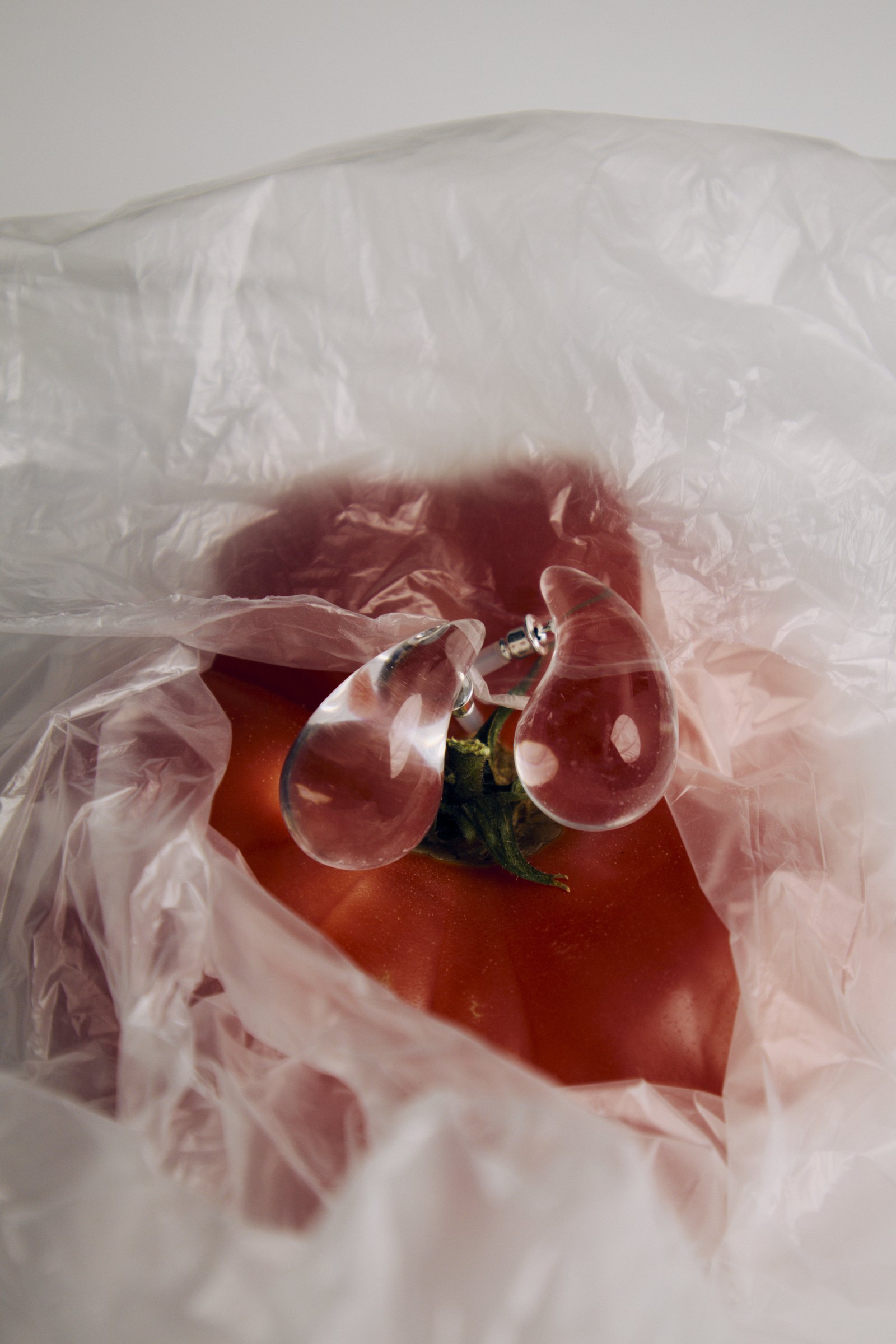 Drop earrings on a tomato