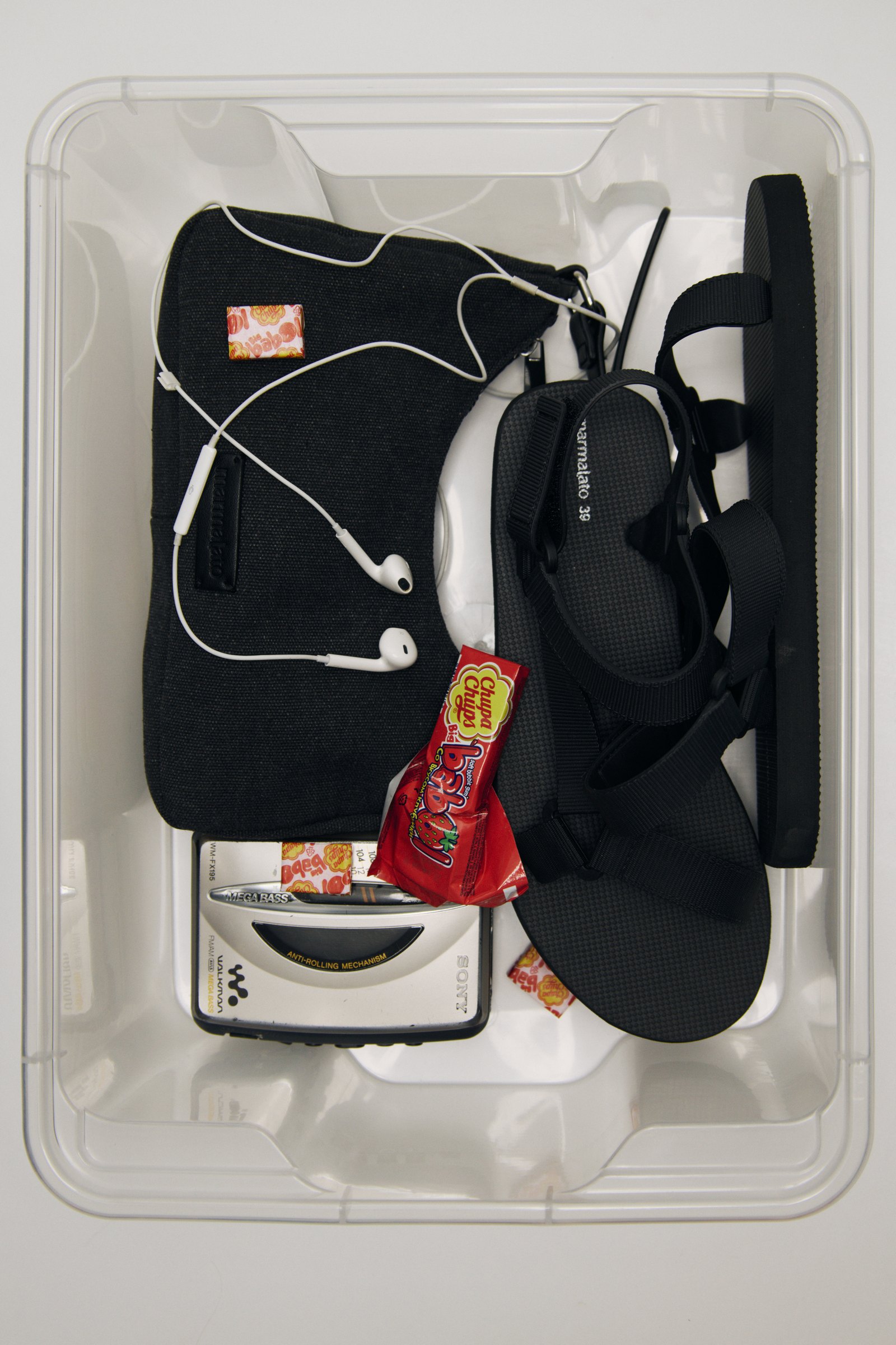 The sale haul — box with sandals and walkman