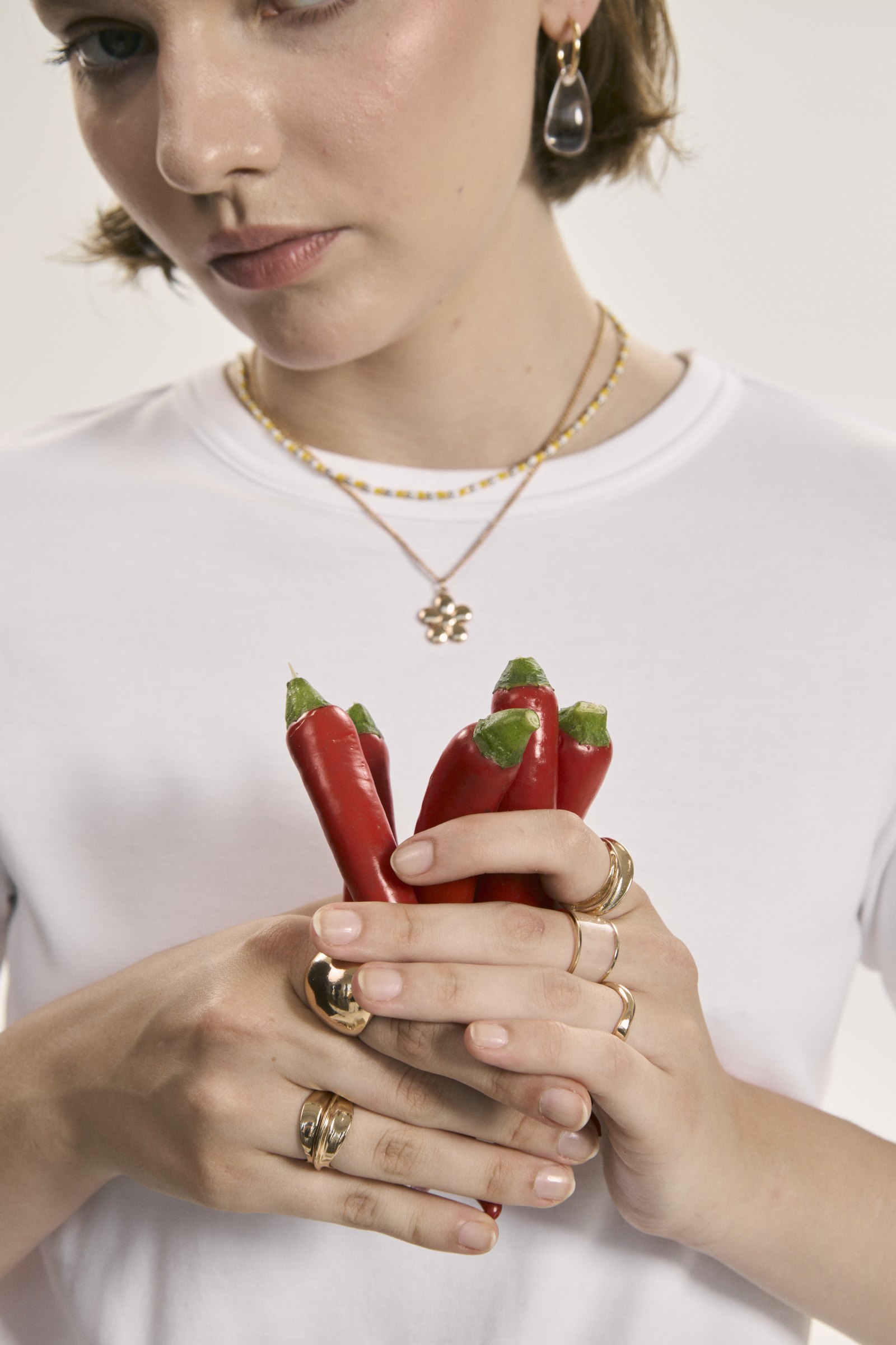 Model holding peppers