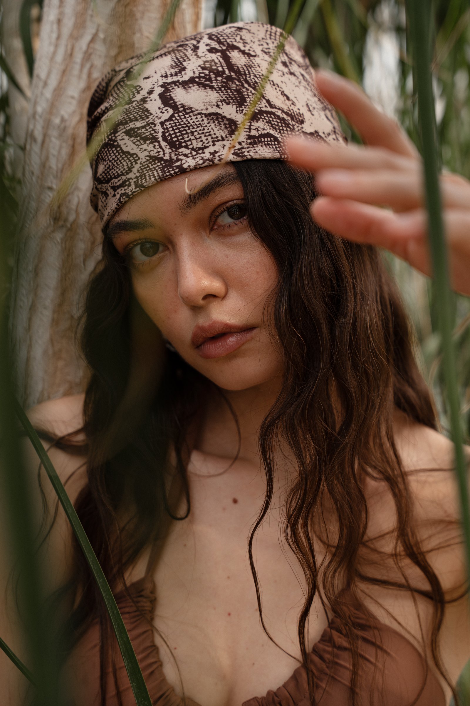 Portrait in snake-print scarf
